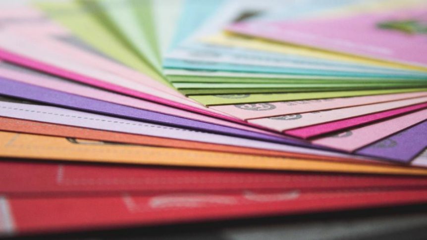 Fanned stack of colorful paper cards