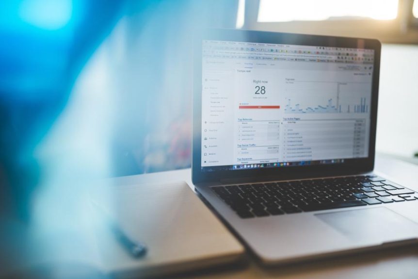 Laptop displaying website analytics charts
