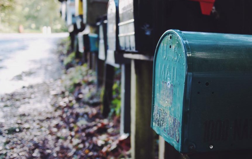 Row of rural mailboxes along a country road in autumn