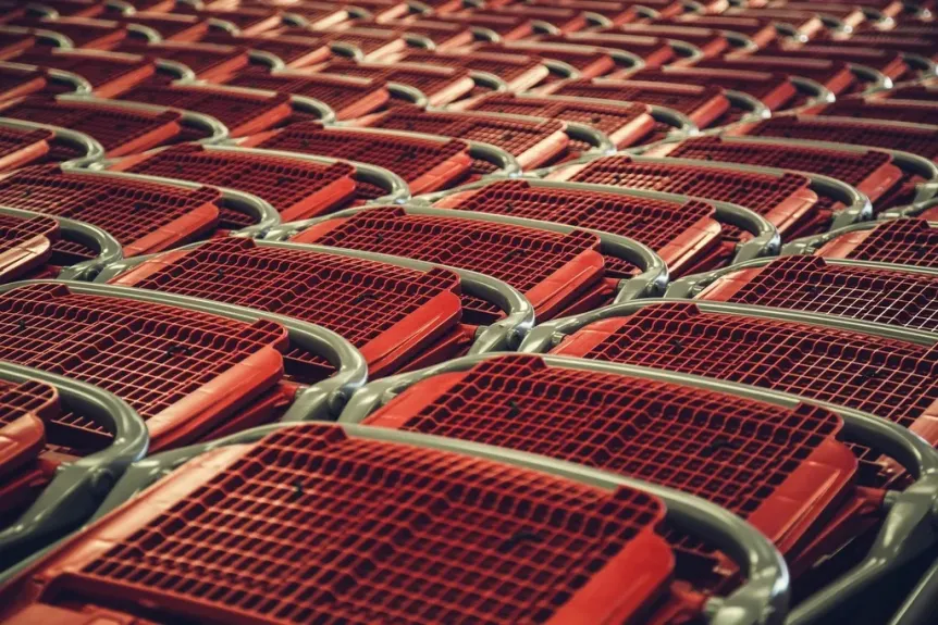 Rows of red shopping carts stacked together
